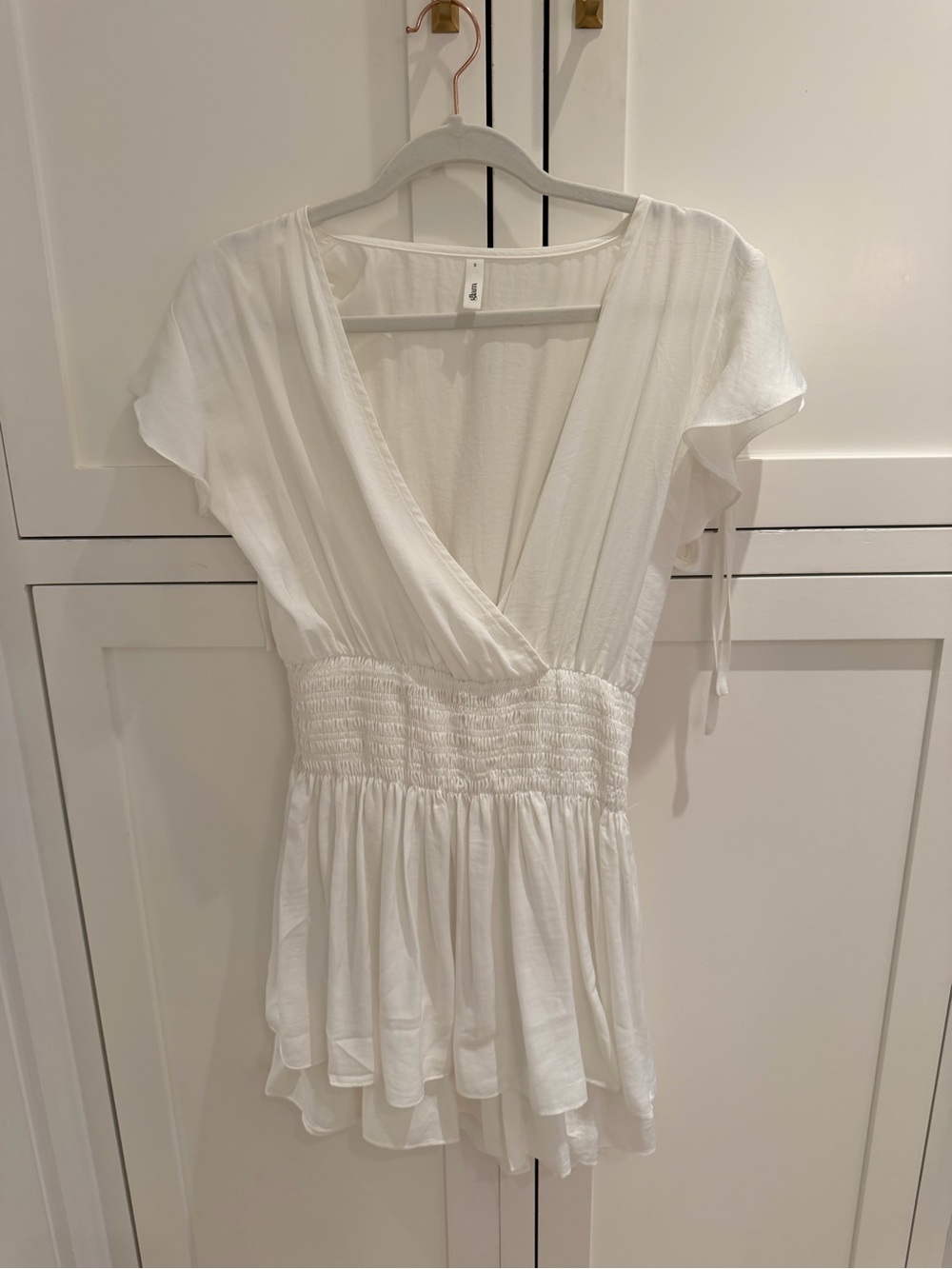 Glam White Surplice Waist Smocked Mini Dress